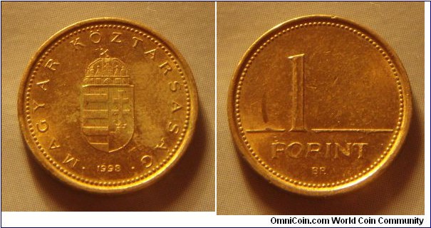 Hungary | 
1 Forint, 1998 | 
16.3 mm, 2.05 gr. | 
Nickel-brass | 

Obverse: National Coat of Arms, date below | 
Lettering: • MAGYAR KÖZTÁRSASÁG • 1998 | 

Reverse: Denomination | 
Lettering: 1 FORINT |