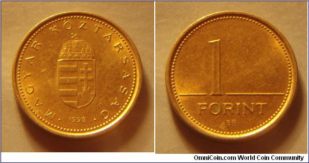 Hungary | 
1 Forint, 1998 | 
16.3 mm, 2.05 gr. | 
Nickel-brass | 

Obverse: National Coat of Arms, date below | 
Lettering: • MAGYAR KÖZTÁRSASÁG • 1998 | 

Reverse: Denomination | 
Lettering: 1 FORINT |