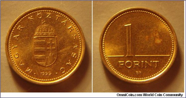 Hungary | 
1 Forint, 1999 | 
16.3 mm, 2.05 gr. | 
Nickel-brass | 

Obverse: National Coat of Arms, date below | 
Lettering: • MAGYAR KÖZTÁRSASÁG • 1999 | 

Reverse: Denomination | 
Lettering: 1 FORINT |