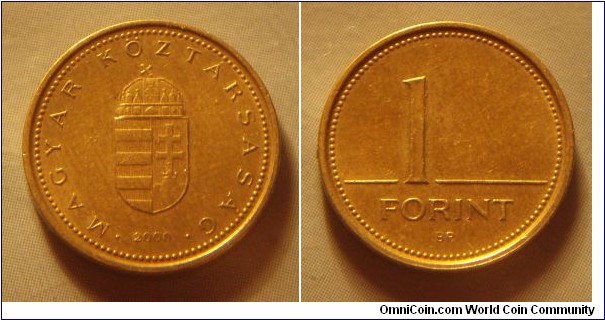 Hungary | 
1 Forint, 2000 | 
16.3 mm, 2.05 gr. | 
Nickel-brass | 

Obverse: National Coat of Arms, date below | 
Lettering: • MAGYAR KÖZTÁRSASÁG • 2000 | 

Reverse: Denomination | 
Lettering: 1 FORINT |