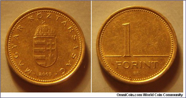 Hungary | 
1 Forint, 2003 | 
16.3 mm, 2.05 gr. | 
Nickel-brass | 

Obverse: National Coat of Arms, date below | 
Lettering: • MAGYAR KÖZTÁRSASÁG • 2003 | 

Reverse: Denomination | 
Lettering: 1 FORINT |