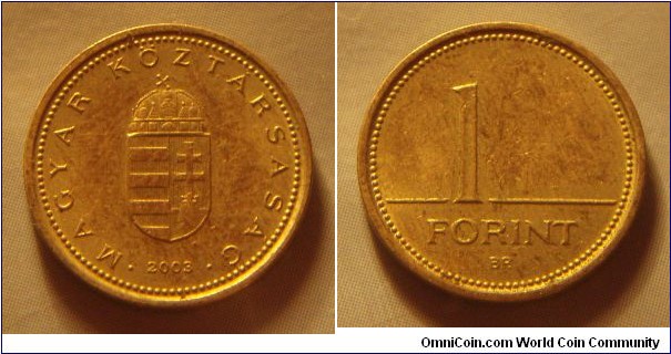Hungary | 
1 Forint, 2003 | 
16.3 mm, 2.05 gr. | 
Nickel-brass | 

Obverse: National Coat of Arms, date below | 
Lettering: • MAGYAR KÖZTÁRSASÁG • 2003 | 

Reverse: Denomination | 
Lettering: 1 FORINT |