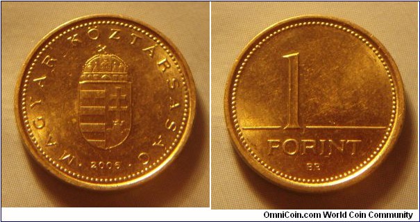 Hungary | 
1 Forint, 2006 | 
16.3 mm, 2.05 gr. | 
Nickel-brass | 

Obverse: National Coat of Arms, date below | 
Lettering: • MAGYAR KÖZTÁRSASÁG • 2006 | 

Reverse: Denomination | 
Lettering: 1 FORINT |