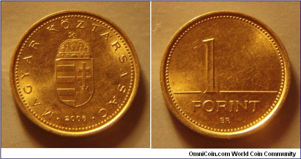 Hungary | 
1 Forint, 2006 | 
16.3 mm, 2.05 gr. | 
Nickel-brass | 

Obverse: National Coat of Arms, date below | 
Lettering: • MAGYAR KÖZTÁRSASÁG • 2006 | 

Reverse: Denomination | 
Lettering: 1 FORINT |