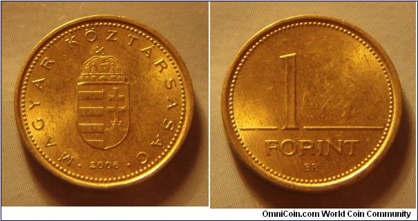 Hungary | 
1 Forint, 2006 | 
16.3 mm, 2.05 gr. | 
Nickel-brass | 

Obverse: National Coat of Arms, date below | 
Lettering: • MAGYAR KÖZTÁRSASÁG • 2006 | 

Reverse: Denomination | 
Lettering: 1 FORINT |