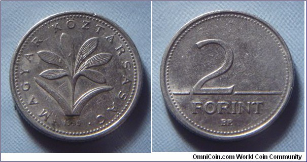 Hungary | 
2 Forint, 1995 | 
19 mm, 3.1 gr. | 
Copper-nickel | 

Obverse: The Hungarian crocus (Colchium Hungaricum), date below | 
Lettering: • MAGYAR KÖZTÁRSASÁG • 1995 | 

Reverse: Denomination | 
Lettering: 2 FORINT |