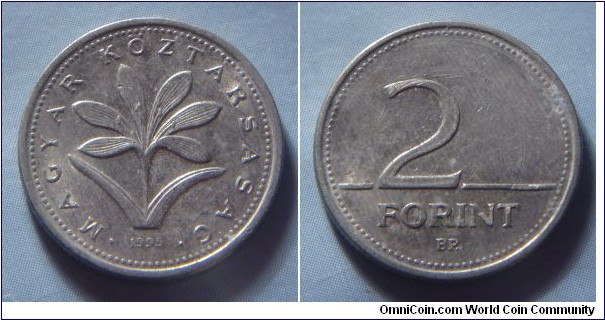 Hungary | 
2 Forint, 1995 | 
19 mm, 3.1 gr. | 
Copper-nickel | 

Obverse: The Hungarian crocus (Colchium Hungaricum), date below | 
Lettering: • MAGYAR KÖZTÁRSASÁG • 1995 | 

Reverse: Denomination | 
Lettering: 2 FORINT |