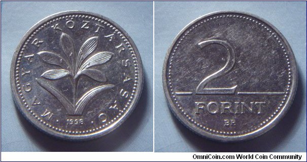 Hungary | 
2 Forint, 1998 | 
19 mm, 3.1 gr. | 
Copper-nickel | 

Obverse: The Hungarian crocus (Colchium Hungaricum), date below | 
Lettering: • MAGYAR KÖZTÁRSASÁG • 1998 | 

Reverse: Denomination | 
Lettering: 2 FORINT |