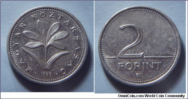 Hungary | 
2 Forint, 1999 | 
19 mm, 3.1 gr. | 
Copper-nickel | 

Obverse: The Hungarian crocus (Colchium Hungaricum), date below | 
Lettering: • MAGYAR KÖZTÁRSASÁG • 1999 | 

Reverse: Denomination | 
Lettering: 2 FORINT |