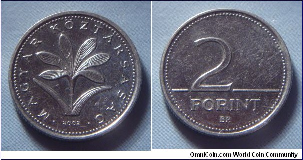 Hungary | 
2 Forint, 2002 | 
19 mm, 3.1 gr. | 
Copper-nickel | 

Obverse: The Hungarian crocus (Colchium Hungaricum), date below | 
Lettering: • MAGYAR KÖZTÁRSASÁG • 2002 | 

Reverse: Denomination | 
Lettering: 2 FORINT |