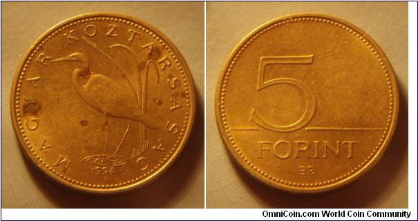 Hungary | 
5 Forint, 1994 | 
21.2 mm, 4.2 gr. | 
Nickel-brass | 

Obverse: Crane bird (or Great White Egret), date below | 
Lettering: • MAGYAR KÖZTÁRSASÁG • 1994 | 

Reverse: Denomination | 
Lettering: 5 FORINT |