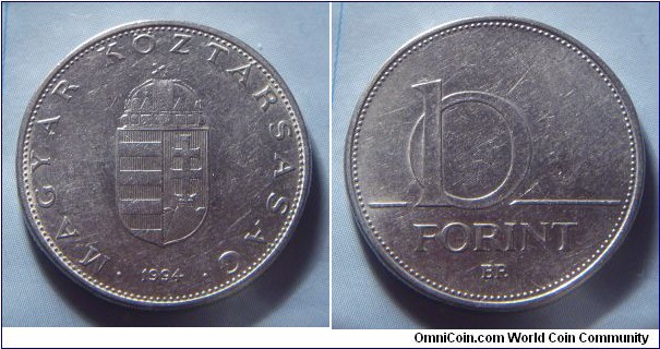 Hungary | 
10 Forint, 1994 | 
24.8 mm, 6.1 gr. | 
Copper-nickel | 

Obverse: National Coat of Arms, date below | 
Lettering: • MAGYAR KÖZTÁRSASÁG • 1994 | 

Reverse: Denomination | 
Lettering: 10 FORINT |