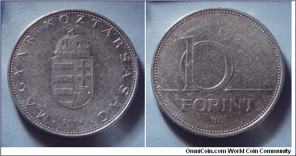 Hungary | 
10 Forint, 2004 | 
24.8 mm, 6.1 gr. | 
Copper-nickel | 

Obverse: National Coat of Arms, date below | 
Lettering: • MAGYAR KÖZTÁRSASÁG • 2004 | 

Reverse: Denomination | 
Lettering: 10 FORINT |