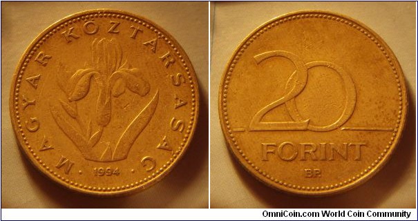 Hungary | 
20 Forint, 1994 | 
26.3 mm, 6.9 gr. | 
Nickel-brass | 

Obverse: Hugarian iris, date below | 
Lettering: • MAGYAR KÖZTÁRSASÁG • 1994 | 

Reverse: Denomination | 
Lettering: 20 FORINT |