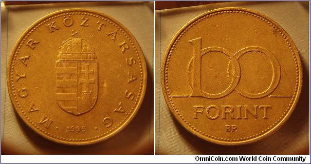 Hungary | 
100 Forint, 1995 | 
29.2 mm, 9.4 gr. | 
Nickel-brass | 

Obverse: National Coat of Arms, date below | 
Lettering: • MAGYAR KÖZTÁRSASÁG • 1995 | 

Reverse: Denomination | 
Lettering: 100 FORINT |