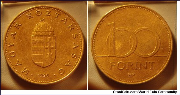 Hungary | 
100 Forint, 1996 | 
29.2 mm, 9.4 gr. | 
Nickel-brass | 

Obverse: National Coat of Arms, date below | 
Lettering: • MAGYAR KÖZTÁRSASÁG • 1996 | 

Reverse: Denomination | 
Lettering: 100 FORINT |