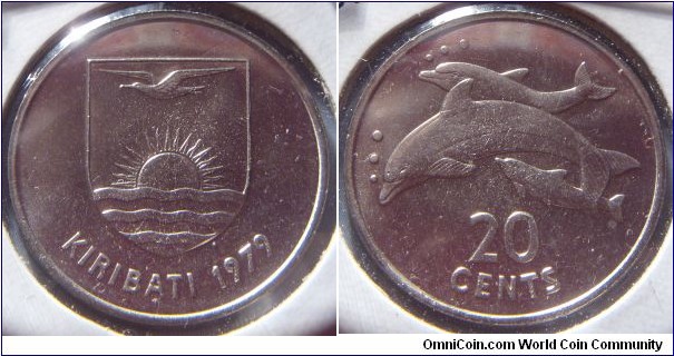 Kiribati | 
20 Cents, 1979 | 
28.45 mm, 11.15 gr. | 
Copper-nickel | 

Obverse: National Coat of Arms, date below | 
Lettering: KIRIBATI 1979 |

Reverse: Three dolphins, denomination below | 
Lettering: 20 CENTS |