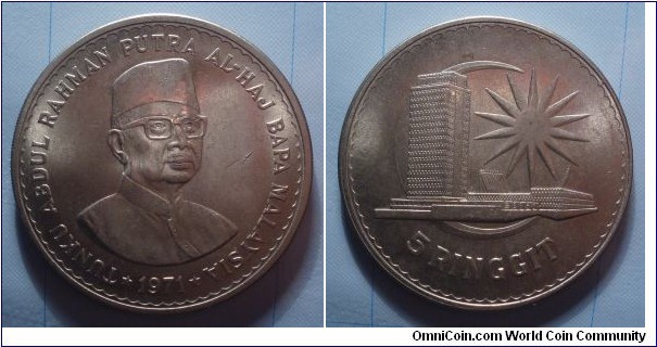 Malaysia | 
5 Ringgit, 1971 | 
37 mm, 28.8 gr. | 
Copper-nickel | 

Obverse: Tunku Abdul Rahman Al-Haj, first prime minister of Malaya | 
Lettering: * TUNKU ABDUL RAHMAN AL-HAJ BAPA MALAYSIA * 1971 |

Reverse: Parliament building infront of moon crescent and a 14-pointed star | 
Lettering: 5 RINGGIT | 