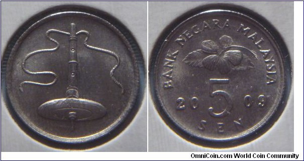 Malaysia | 
5 Sen, 2009 | 
16.25 mm, 1.41 gr. | 
Copper-nickel | 

Obverse: Top spinning with string | 

Reverse: Flower blossom, denomination below divides date | 
Lettering: BANK NEGARA MALAYSIA 2009 5 SEN |