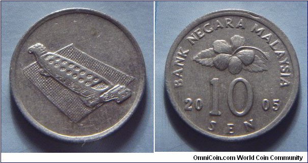 Malaysia | 
10 Sen, 2005 | 
19.4 mm, 1.82 gr. | 
Copper-nickel | 

Obverse: Congkak (Malay game) | 

Reverse: Flower blossom, denomination below divides date | 
Lettering: BANK NEGARA MALAYSIA 2005 10 SEN |