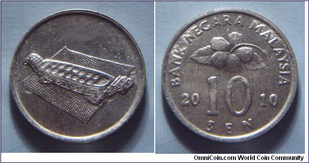 Malaysia | 
10 Sen, 2010 | 
19.4 mm, 1.82 gr. | 
Copper-nickel | 

Obverse: Congkak (Malay game) | 

Reverse: Flower blossom, denomination below divides date | 
Lettering: BANK NEGARA MALAYSIA 2010 10 SEN |