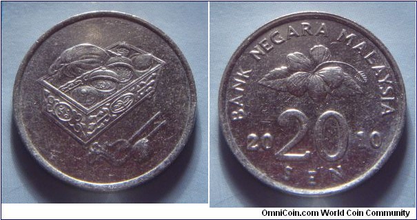 Malaysia | 
20 Sen, 2010 | 
23.57 mm, 5.69 gr. | 
Copper-nickel | 

Obverse: Sirih and Kapur container | 

Reverse: Flower blossom, denomination below divides date | 
Lettering: BANK NEGARA MALAYSIA 2010 20 SEN |