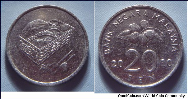 Malaysia | 
20 Sen, 2010 | 
23.57 mm, 5.69 gr. | 
Copper-nickel | 

Obverse: Sirih and Kapur container | 

Reverse: Flower blossom, denomination below divides date | 
Lettering: BANK NEGARA MALAYSIA 2010 20 SEN |