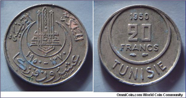 French protectorate of Tunisia | 
20 Francs, 1950 | 
23.2 mm, 5.65 gr. | 
Copper-nickel | 

Obverse: Gregorian and Islamic date in Arabic numbers | 
Lettering: المملكة التونسية ١٣٧٠-١٩٥٠ عشرون فرنكا |

Reverse: Denomination, date above | 
Lettering: 1950 20 FRANCS TUNISIE |