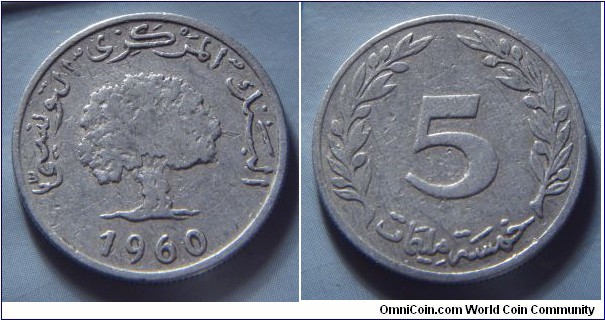 Tunisia | 
5 Millimes, 1960 | 
23.97 mm, 1.5 gr. | 
Aluminium | 

Obverse: Oak Tree, date below | 
Lettering: البنك المركزي التونسي 1960 |

Reverse: Denomination | 
Lettering: 5 خمسـة مليمات |
