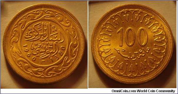 Tunisia | 
100 Millimes, 1960 | 
27 mm, 7.5 gr. | 
Brass | 

Obverse: Date | 
Lettering: البنك المركزي التونسي 1960-1380 |

Reverse: Denomination | 
Lettering: 100 مائة مليم |