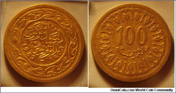 Tunisia | 
100 Millimes, 1983 | 
27 mm, 7.5 gr. | 
Brass | 

Obverse: Date | 
Lettering: البنك المركزي التونسي 1983-1403 |

Reverse: Denomination | 
Lettering: 100 مائة مليم |