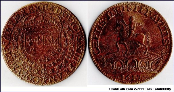 yellow copper jeton struck for the kings administration during the reign of Louis XIII and to commemorate the taking of Toulouse