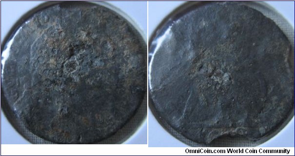 very corroded tin farthing, damage at date however enough there to date it to 1690