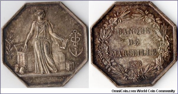 Nice rainbow toned silver jeton de presence struck for the banque de Marseille in 1836. This bank was subsumed by the Banque de France in 1848.