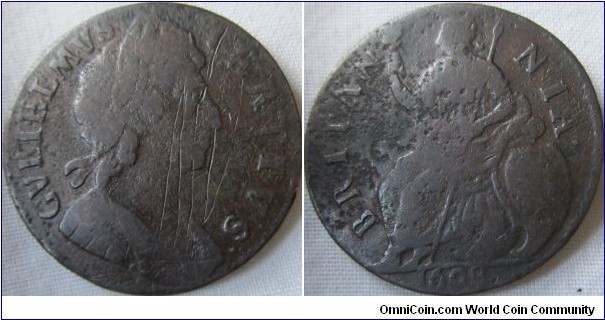 rare 1698 halfpenny, date in Exergue, fair grade but some corrosion damage on reverse and scratches on obverse