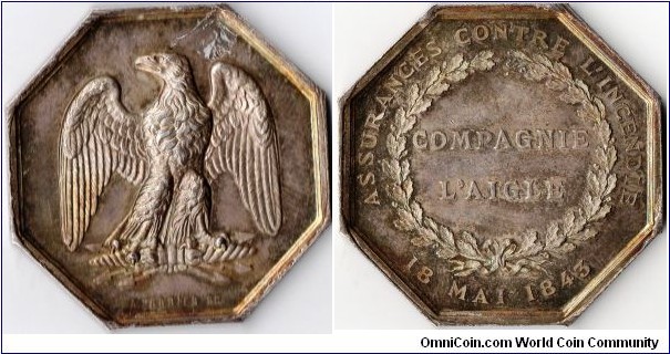 a fairly common silver jeton de presence struck for `L'Aigle' (The Eagle, a french assurer covering fire risks.