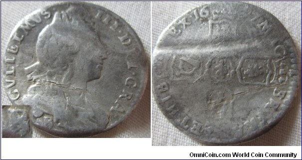 1697 sixpence B over E mintmark, bent into a love token