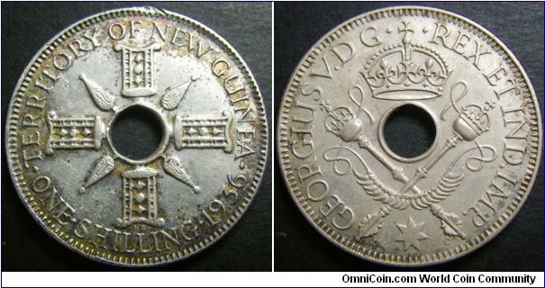 New Guinea 1936 1 shilling. Toned on one side. Weight: 5.40g.