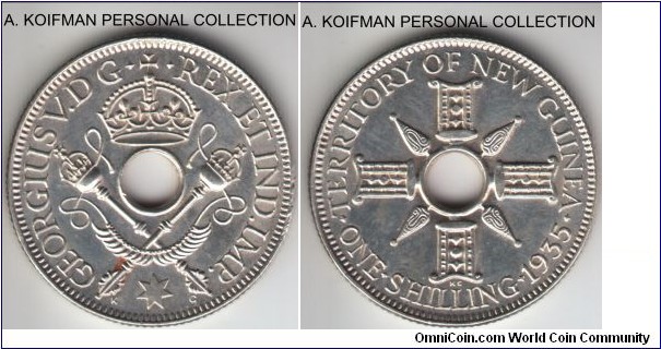 KM-5, 1935 New Guinea shilling; silver, reeded edge; uncirculated or about, maybe weakly struck on obverse, as highest detail show flatness yet there are no obvious signs of circulation, flan defect at 3 o'clock on obverse.