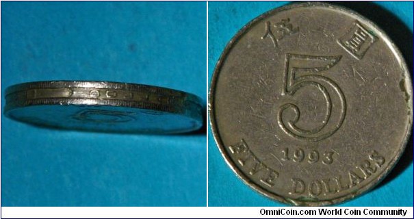 Unique edge of 5 dollar coin.  Lettering saying  HONG KONG FIVE DOLLARS 香 港 伍 圓 (ref. http://en.numista.com/catalogue/pieces1576.html)