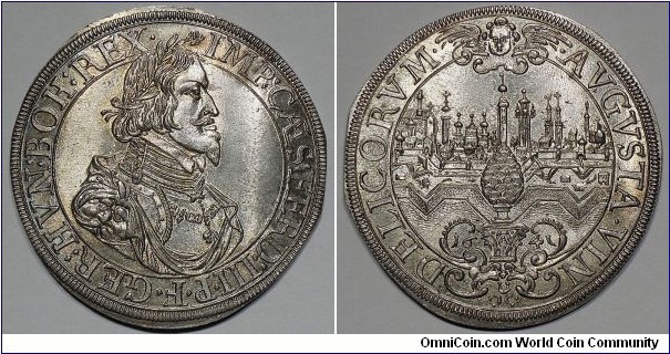 Augsburg (Freie Reichsstadt). Ferdinand III. Holy Roman Emperor (1637-1657). Taler. 29g, ca. 44mm. 1641. Obv. Laureate, draped, and armored bust right, wearing Order of the Golden Fleece. Rev. Veduta of Augsburg; cherub above; below, pine cone set upon ornate base. Forster# 285; KM# 77; Davenport# 5039. Brilliant uncirculated.
