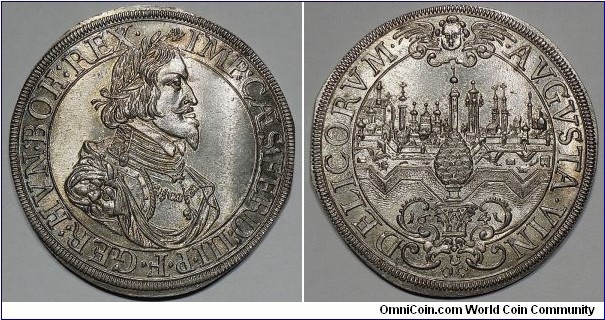 Augsburg (Freie Reichsstadt). Ferdinand III. Holy Roman Emperor (1637-1657). Taler. 29g, ca. 44mm. 1641. Obv. Laureate, draped, and armored bust right, wearing Order of the Golden Fleece. Rev. Veduta of Augsburg; cherub above; below, pine cone set upon ornate base. Forster# 285; KM# 77; Davenport# 5039. Brilliant uncirculated.