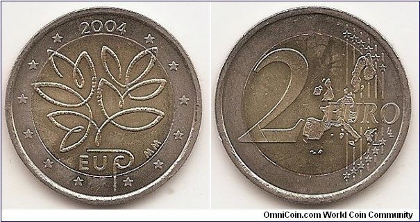 2 Euro
KM#114
8.5000 g., Bi-Metallic Nickel-Brass center in Copper-Nickel ring, 25.75 mm. Subject: Fifth Enlargement of the European Union in 2004 Obv: The coin's design resembles a stylised pillar from which ten sprouts grow upwards. This is a metaphorical theme: The ten sprouts represent the growth of the European Union (i.e., the 2004 enlargement which added ten new member states), while the pillar represents the foundation for the growth. Near the bottom of the coin, below the pillar, the word EU is written, and together with the right side of the pillar, representing the Greek small letter 