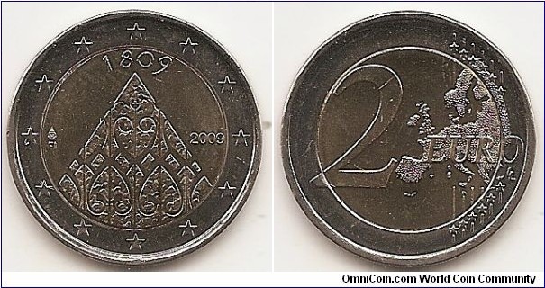 2 Euro
KM#149
8.5000 g., Bi-Metallic Nickel-Brass center in Copper-Nickel ring, 25.75 mm. Subject: 200th Anniversary of Finnish Autonomy. Obv: The inner part of the coin depicts the profile of the Porvoo Cathedral, which was the site of opening of the first Diet of Finland. The date 1809 appears on the top, and the year mark is on the right side. The indication of the issuing country FI and the mint mark are on the left side. The twelve stars of the European Union surround the design on the outer ring of the coin. Rev: 2 on the left-hand side, six straight lines run vertically between the lower and upper right-hand side of the face, 12 stars are superimposed on these lines, one just before the two ends of each line, superimposed on the mid - and upper section of these lines; the European continent ( extended ) is represented on the right-hand side of the face; the right-hand part of the representation is superimposed on the mid-section of the lines; the word ‘EURO’ is superimposed horizontally across the middle of the right-hand side of the face. Under the ‘O’ of EURO, the initials ‘LL’ of the engraver appear near the right-hand edge of the coin. Edge: Reeded with SUOMI FINLAND * * * (the * stands for a lion's head). Obv. designer: Reijo Juhani Paavilainen Rev. designer: Luc Luycx