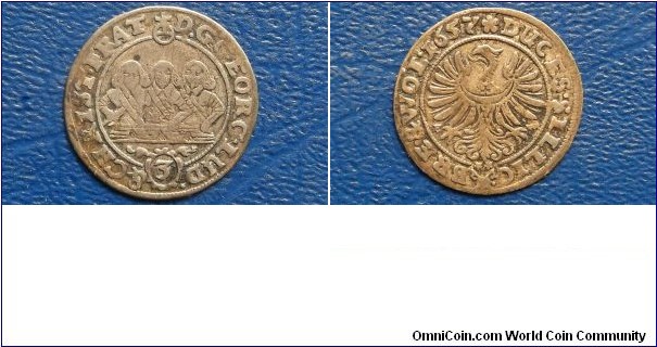 German States SILESIA-LIEGNITZ-BRIEG 3 Kreuzer, 1/24 Thaler KM# 395     1653-1659
1653-1659 German States SILESIA-LIEGNITZ-BRIEG 3 Kreuzer, 1/24 Thaler obverse

	
	1653-1659 German States SILESIA-LIEGNITZ-BRIEG 3 Kreuzer, 1/24 Thaler

  
Specifications

Composition: Silver

Diameter: 20mm
Design

Obverse: 3 facing 1/2-length figures, small imperial orb at top, value '3' in oval below

Obverse Legend: D. G. GEORG. LV - DO. & CHRIST.

Reverse: Silesian eagle in circle, date at end of legend

Reverse Legend: FRAT. DVC. SIL. - LIG. BREG.
Notes

Ruler: Georg III, Ludwig IV and Christian

Note:  Ref: F/S#1727, 1736, 1741-42, 1751-52, 1760-61, 1772, 1781. Varieties exist. 

SOLD !!!!