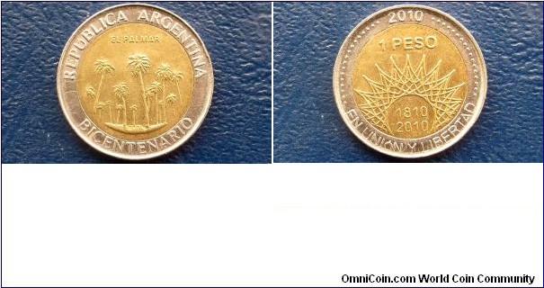 Detailed item info
Properties
Geo	Argentina
Sub Geo	Not Available
Coinage Type	Reform Coinage
Denomination	Peso
Year	2010
Composition	Bi-Metallic
Catalog Number	KM# 156

Subject	Bicentennial - El Palmar
Obverse Description	Stylized radiant sun
Reverse Description	Palm trees
Diameter (mm.)	23