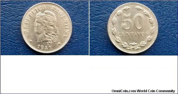 Argentina 50 Centavos KM# 39     1941
Specifications

Composition: Nickel

Weight: 6.0000g

Diameter: 24.50mm
Design

Obverse: Capped liberty head, left

Reverse: Value within wreath

Edge Description: Reeded
Notes

Note:  Prev. KM#14. 