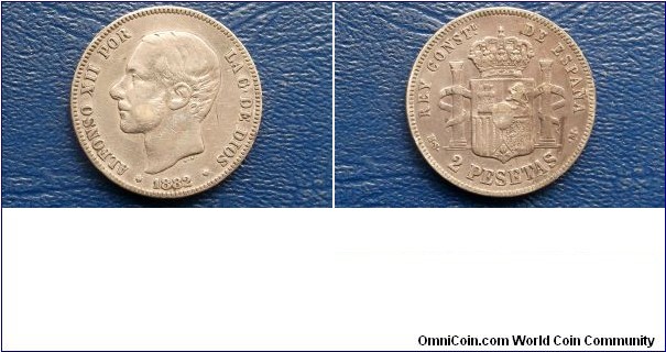 Silver 1882 Spain 2 Pesetas Alfonso XII Crowned Pillars Nice Grade Toned 
Go Here:

http://stores.ebay.com/Mt-Hood-Coins