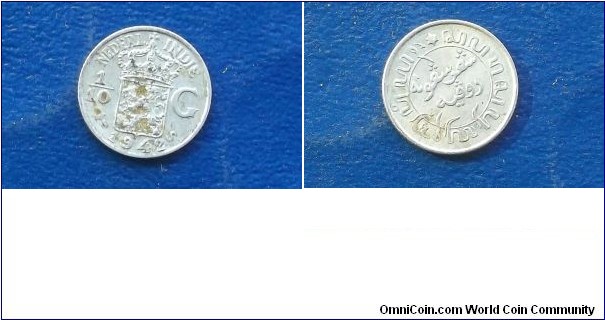 Silver 1942 Netherlands East Indies 1/10 Gulden KM#318 Nice Toned Circ Go Here:

http://stores.ebay.com/Mt-Hood-Coins