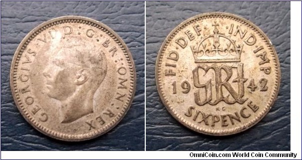 Silver 1942 Great Britain 6 Pence George VI KM# 852 Nice Toned Circ Go Here:

http://stores.ebay.com/Mt-Hood-Coins
